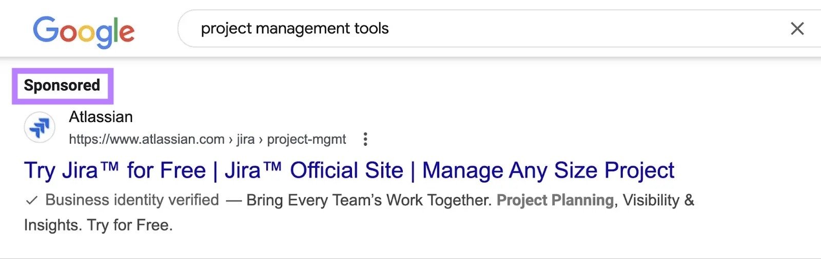 Google SERP for the query "project management tools" with the "Sponsored" tag on the first result highlighted.