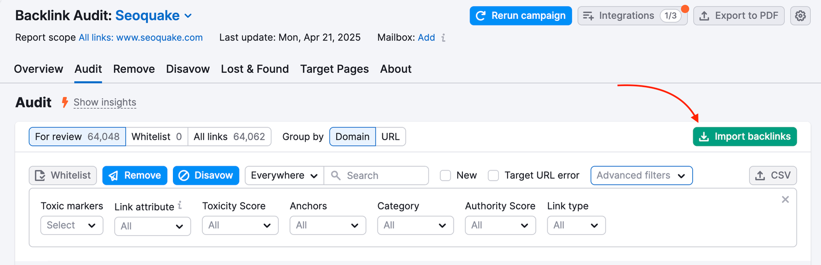 Audit tab in Backlink Audit. A red arrow is pointing to the green 'Import backlinks' button on the right side of the screen.